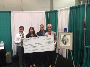 Jim HInes, Holly Hampton, David Cohen and Dianne Oltmann reveal the newly formed J. Richard Oltmann Memorial Scholarship Fund.