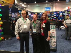 TNT founder Michael Applebaum, A&A Global Industries Executive Vice President Brian Kovens, and TNT owner and key account manager Rachel Rosenberg at the Amusement Expo at A&A Global’s booth.