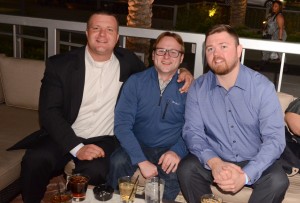A picture of Rappe from this year's Amusement Expo. He is sitting with David Colopy (center) and Liam King (right), both Technical Service Reps for TouchTunes.