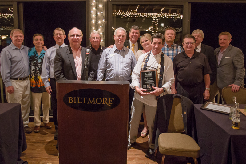 Jack Kelleher (center, with plaque) was honored by an unprecedented showing of friends and AMOA past presidents, including (from left to right) Chris Warren, Mike Leonard, Jerry Johnston, John Pascaretti, Howard Cole, Frank Seninsky, Gaines Butler, Lori Schneider, Russ Mawdsley, Gary Brewer, Bobby Hogin and Andy Shaffer.