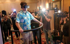 Oculus founder Palmer Luckey tries the 5D Totalmotion platform that is the result of a partnership between Injoy Motion and content creator Futuretown. Injoy says its motion platform is designed to enhance a player's emotional and physical responses by adding a heightened sense of realism to the VR experience.