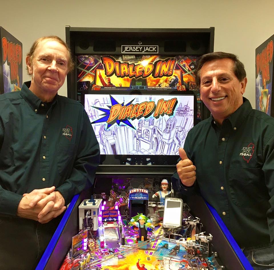 Veteran pinball designer Pat Lawlor (left) and JJP owner Jack Guarnieri with the company's first original concept machine, Dialed In.