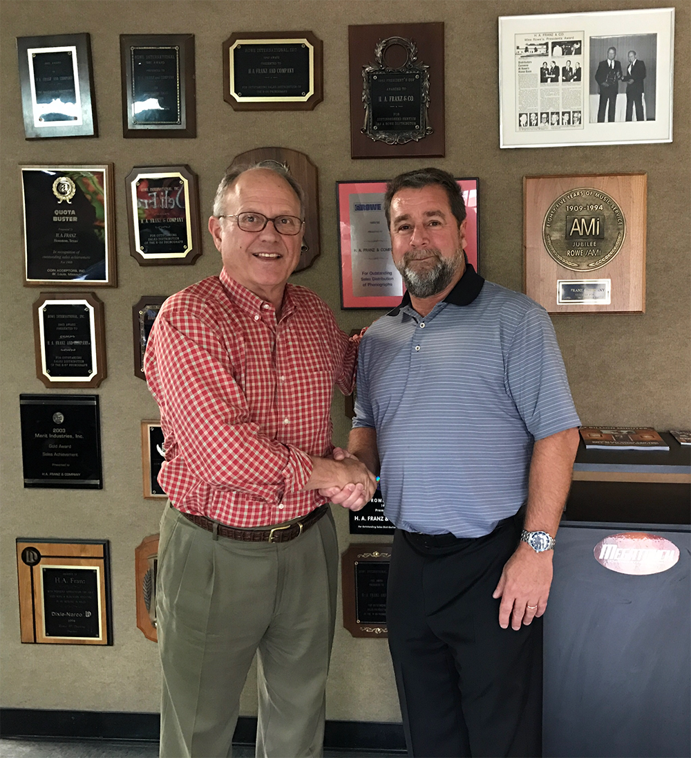  Joe Franz (left) and Vince Gumma shake hands after the acquisition was completed. Going forward, Franz and his team will work under AVS' banner to better serve the industry.