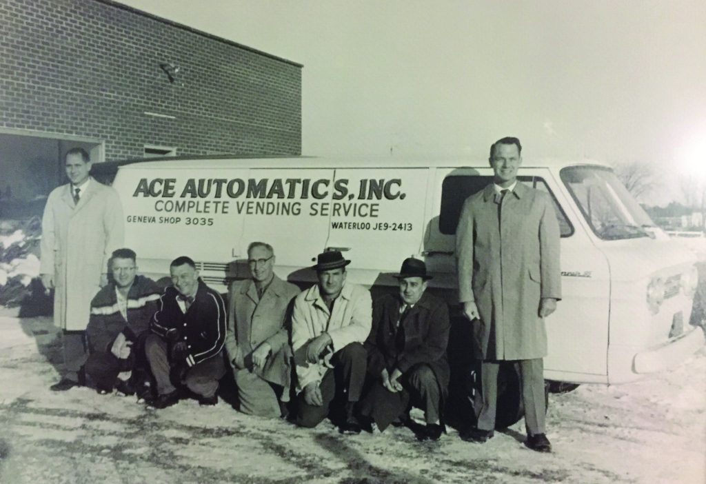 Also from back in the day, we see Dick (left) and Lloyd Hilimire (far right). Kneeling are Fred Schultz, Charlie Wheeler and Al Grant (one time Hilimire partners), Bob Reid (long time service manager) and Til Willis (jukebox record programmer). 