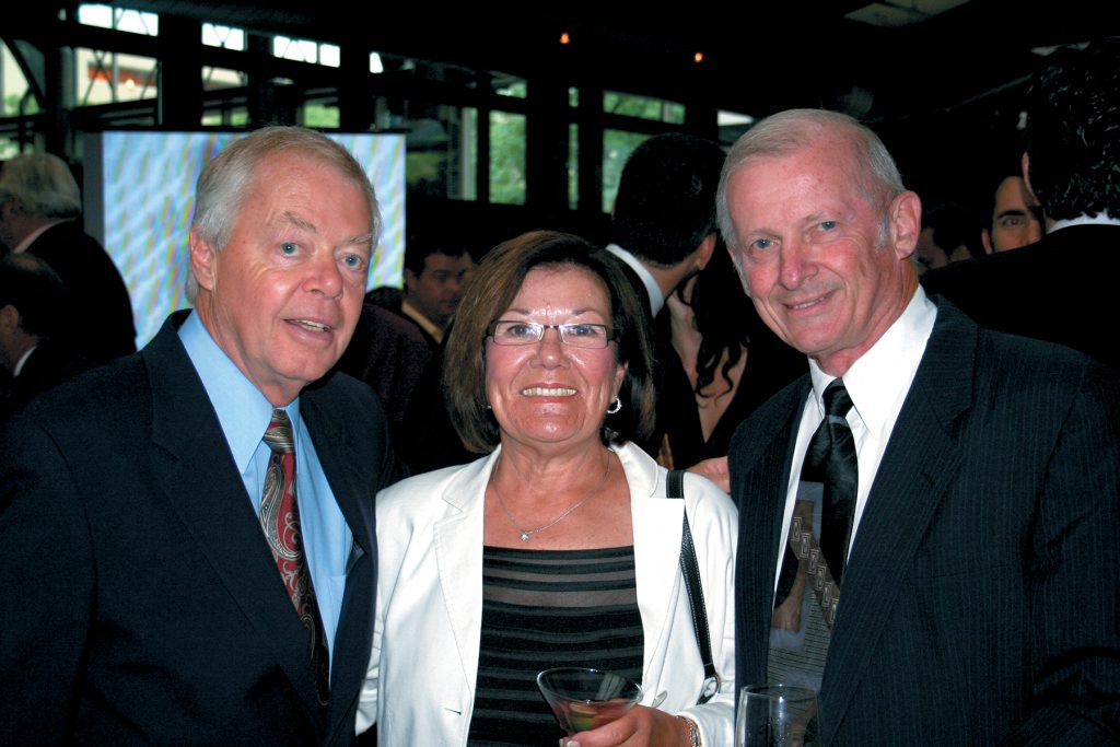 Dick and Margie Hawkins catch up with RePlay publisher Eddie Adlum (left) at a trade function. Everything that "the Hawk" did was big, and his legacy in coin-op 8-ball and dart leagues is huge. 