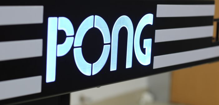 Closeup of Pong name on table