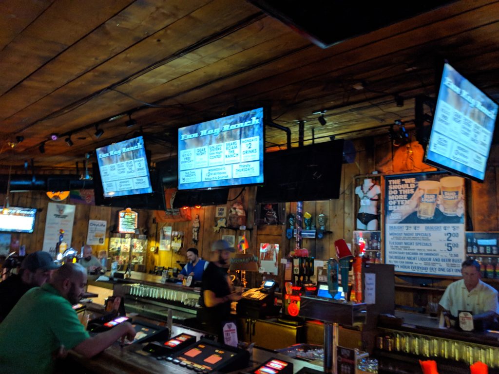 Las Vegas location with jukebox advertising on TV screens.