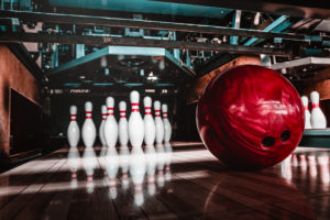 Bowling artsy shot of pins and ball - Adobe Stock