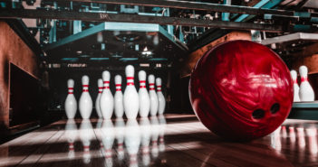 Bowling artsy shot of pins and ball - Adobe Stock