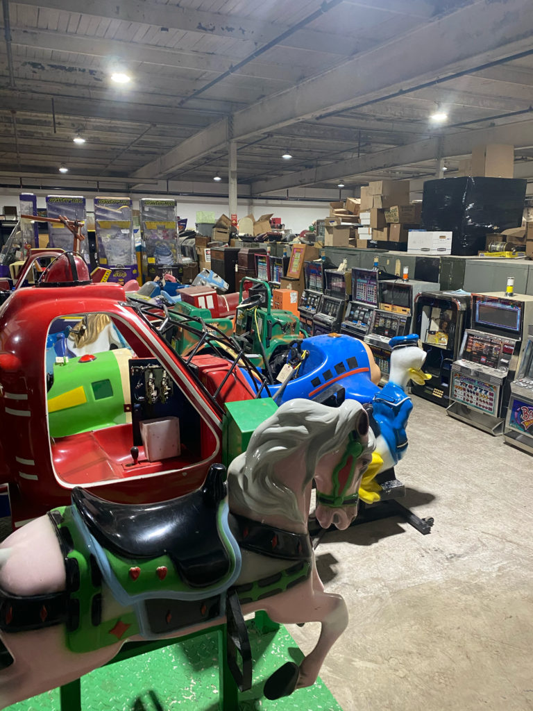 kiddie rides & other equipment in warehouse