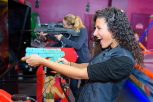 Girl blasts away playing video game