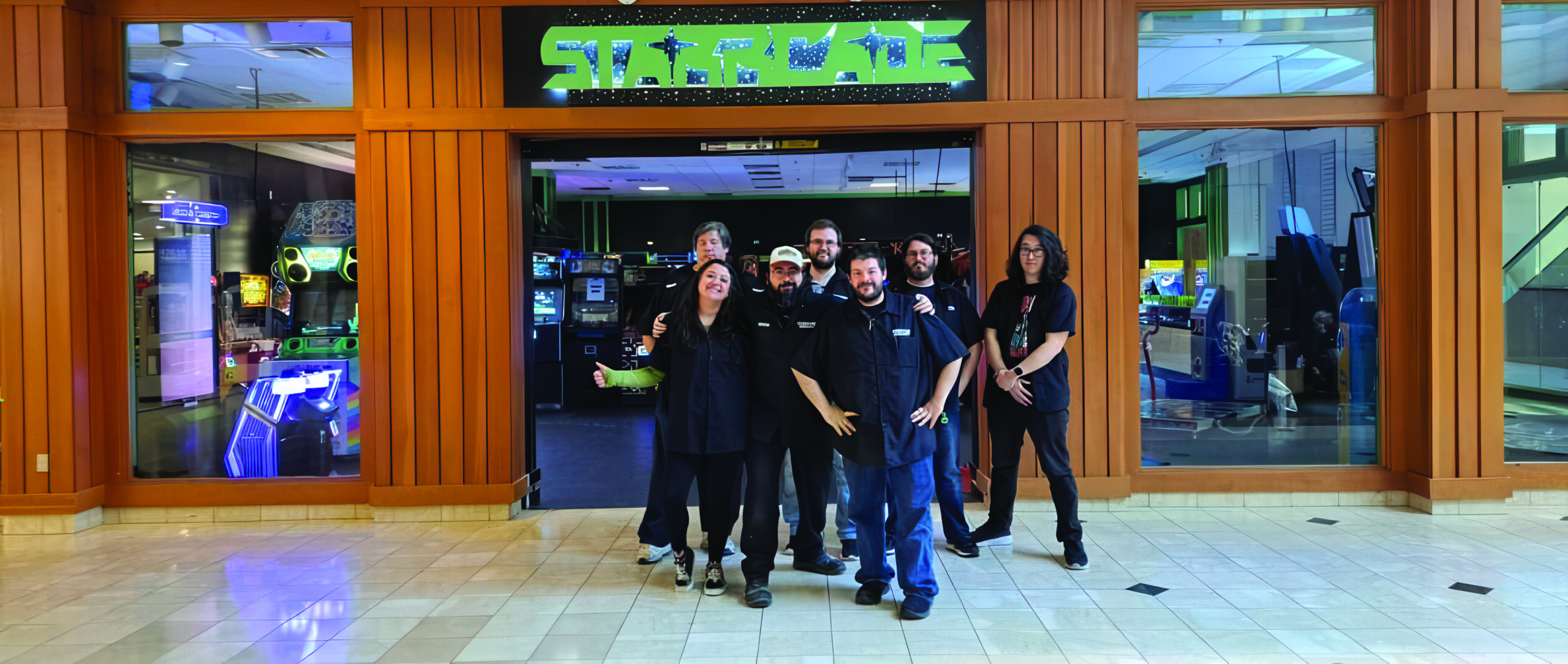 Starrcade team in front of the arcade